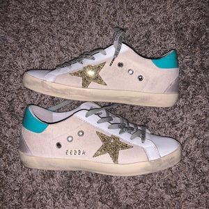 Golden goose superstar teal and gold sneakers
